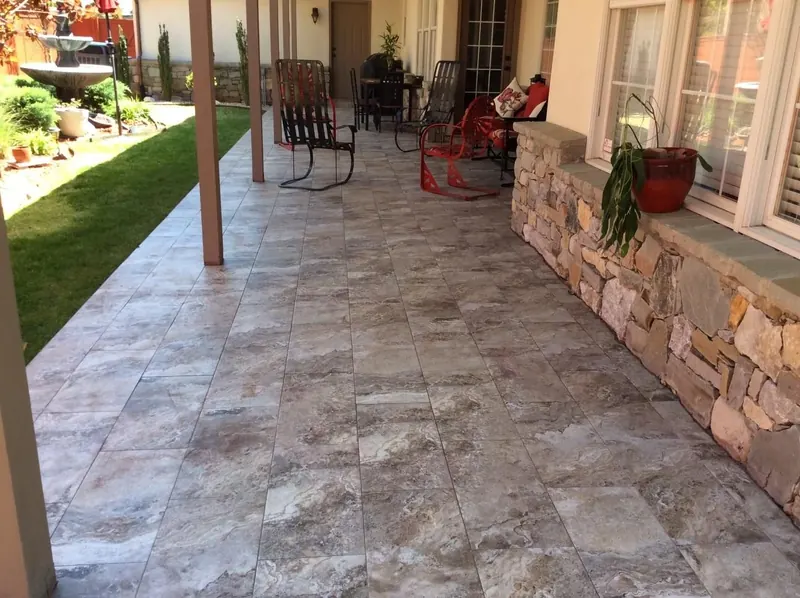 Covered patio with pergola and stone flooring